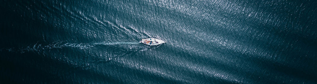 Sailboat on open water representing purpose and connection